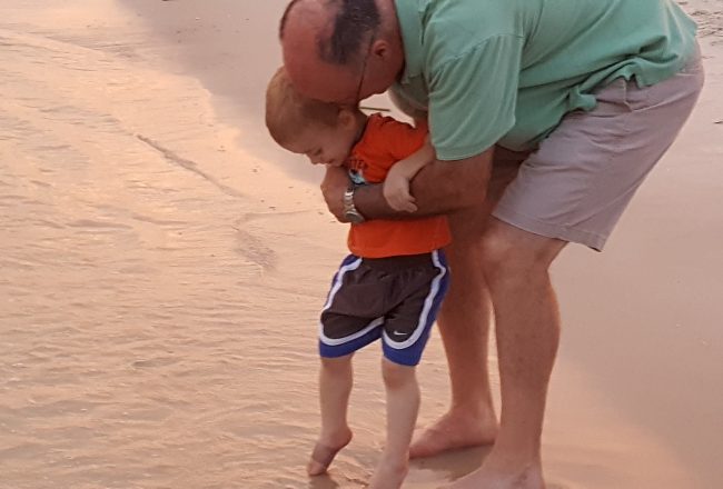 alavhr grandpa with boy at beach