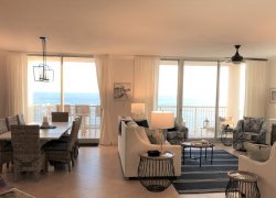  Expansive living and dining area with 28 feet of gulf and  beach  views