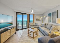  Ocean views from living area with 65 inch ROKU Smart TV, seating for 6, pull out queen bed